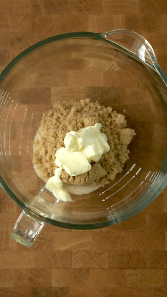 mixing sugar, brown sugar, and butter