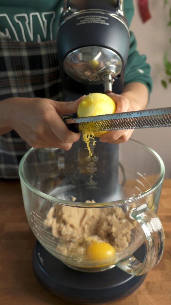 zest of a lemon going in the cookie dough