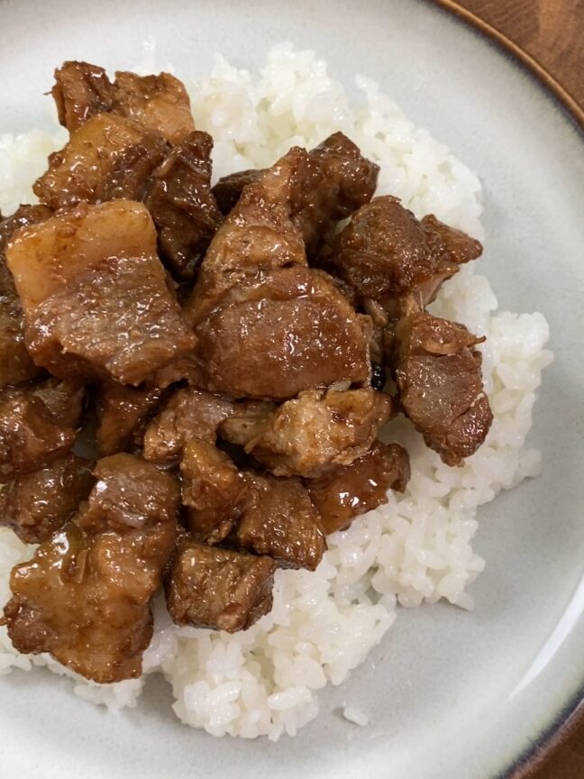 plated pork adobo over rice